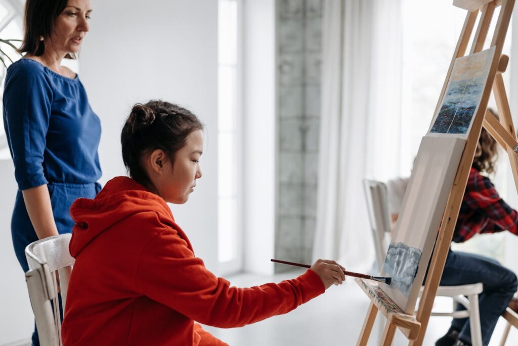 Student doing painting, transform your art class management with a simplified expert approach